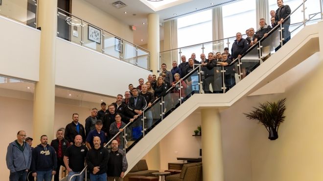 a large group of people standing on a staircase. 