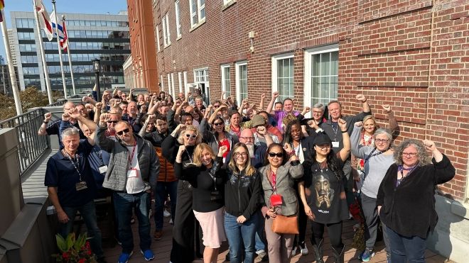 A group of people with fists in the air.