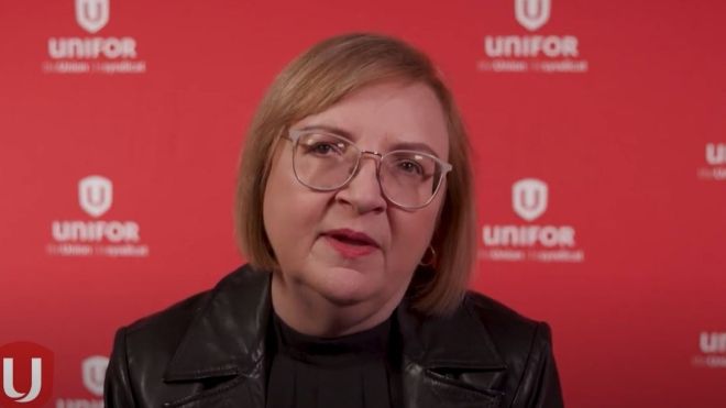 Woman with red Unifor background.