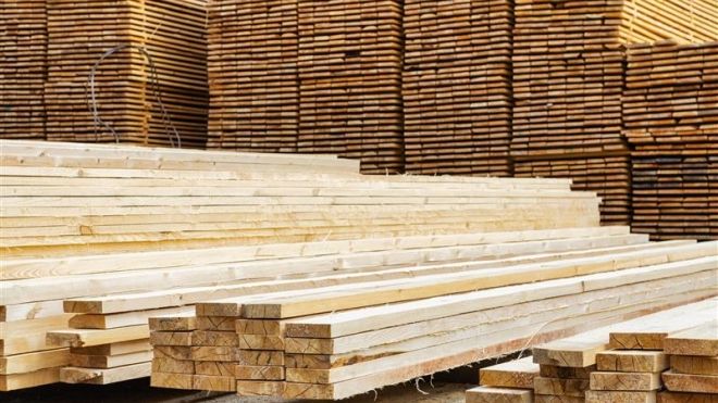 A pile of 2x4 lumber stacked on a skid