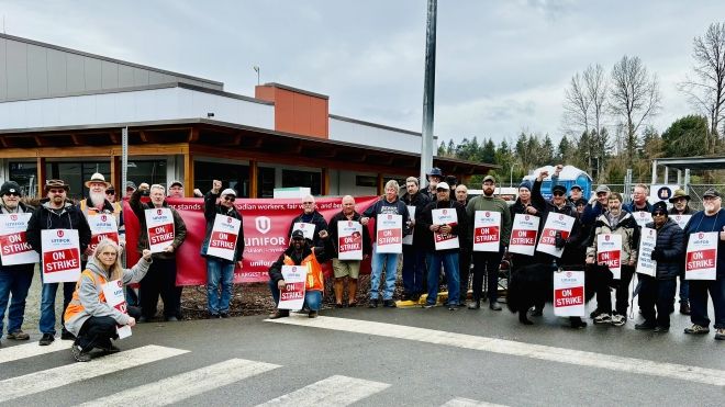 A group of people with strike signs.