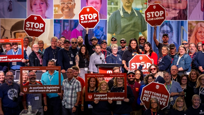 large group on people holding signs to support anti-scab legislation