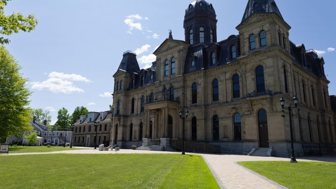 An exterior photo of the New Brunswick Legislature building in summer