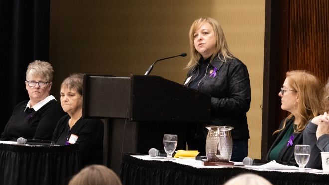 Jennifer Murray speaking at a podium