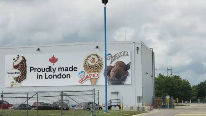 Exterior Nestle building with a billboard "Proudly Made in Canada" images of ice cream, drum stick and drum sticks