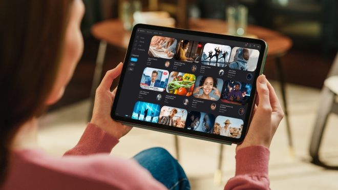 A women looking at a tablet
