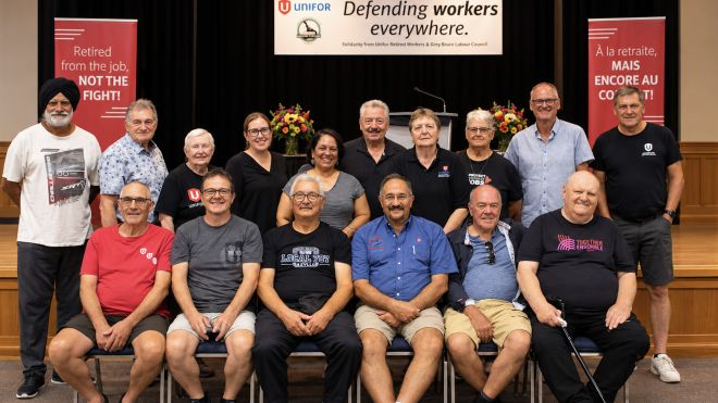 group photo retired workers council, two rows first is seated. 
