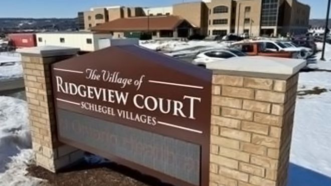 Brick pillars hold a Ridgeview Court sign 