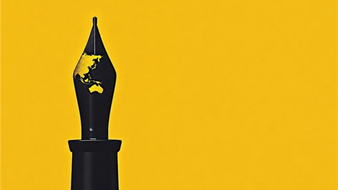 A black fountain pen nib against a yellow background, with a map of Asia and Australia depicted on the nib.
