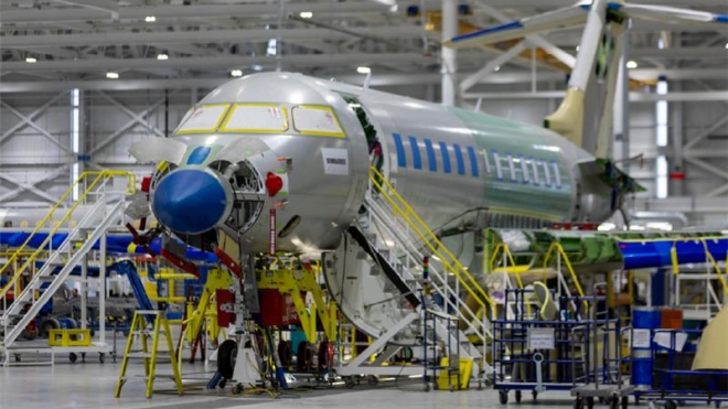A plane being built in a factory