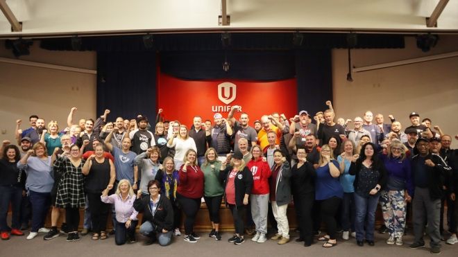 a group posing with their fists raised