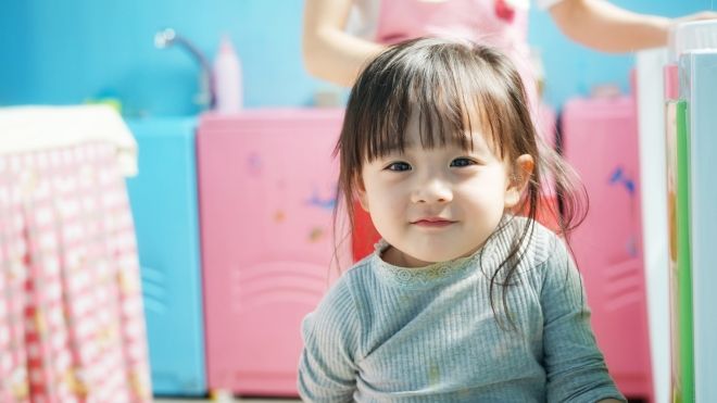 A young child in a daycare setting.
