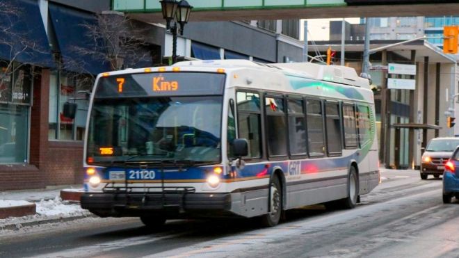 “Bus driving down the road.”