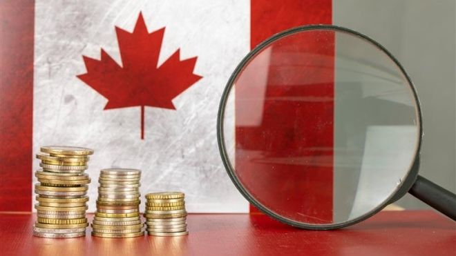 gold coins and a Canadian flag