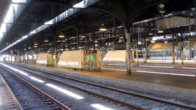 train tracks inside a rail station