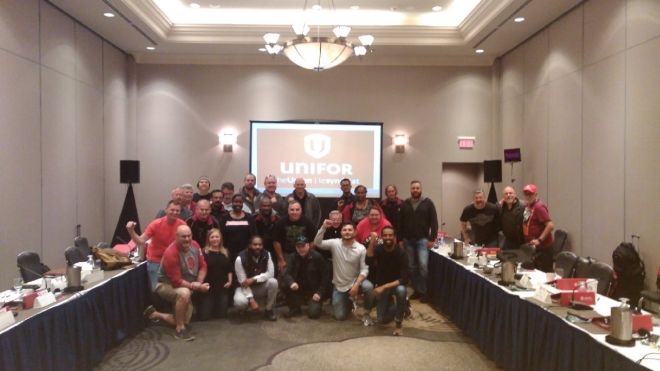 Unifor members from DHL pose for a photo during bargaining preparation meetings.