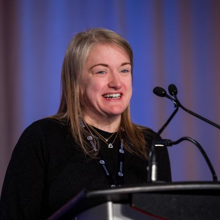 A women at a podium mic