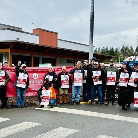A group of people with strike signs.