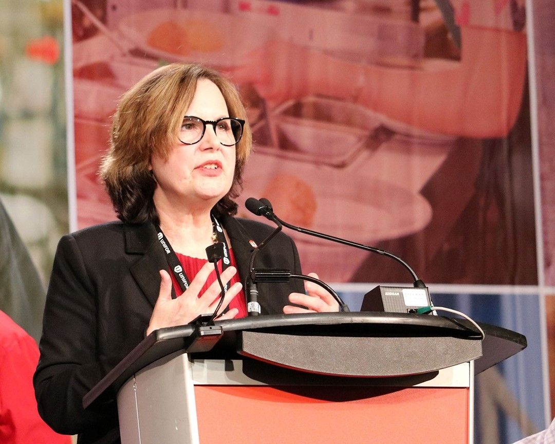 Joie Warnock addresses BC Council delegates from the podium.