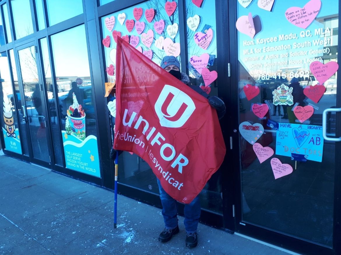 Unifor members take broken heart valentine messages to Alberta MLAs offices.