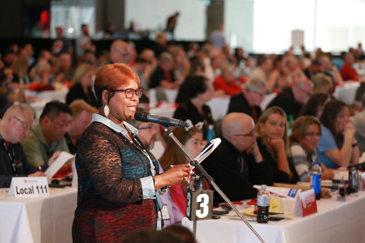 A Unifor member addresses a large delegation from the floor of Canadian Council.
