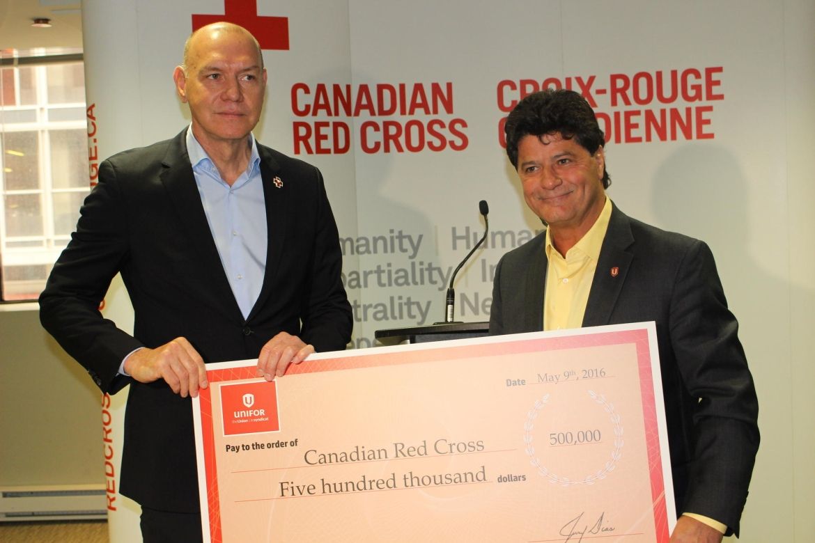 National President Jerry Dias presents cheque to Conrad Sauvé, President and CEO of the Canadian Red Cross