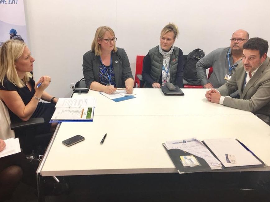 Local 609 member D-Jay Krozser and National Health, Safety, and Environment Director Sari Sairanen take part in a meeting during the  23rd Conference of Parties meeting.