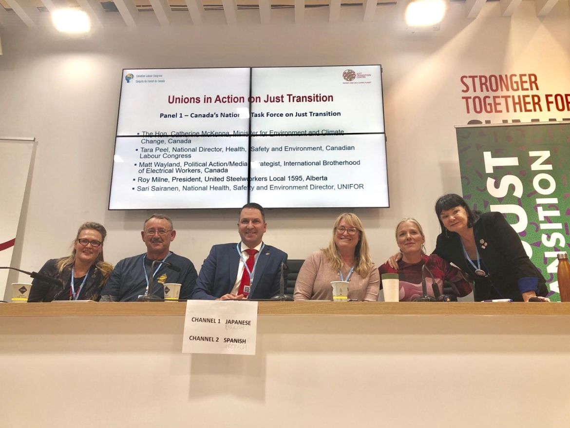 Sari Sairanen with fellow labour activists during a presentation at COP24.