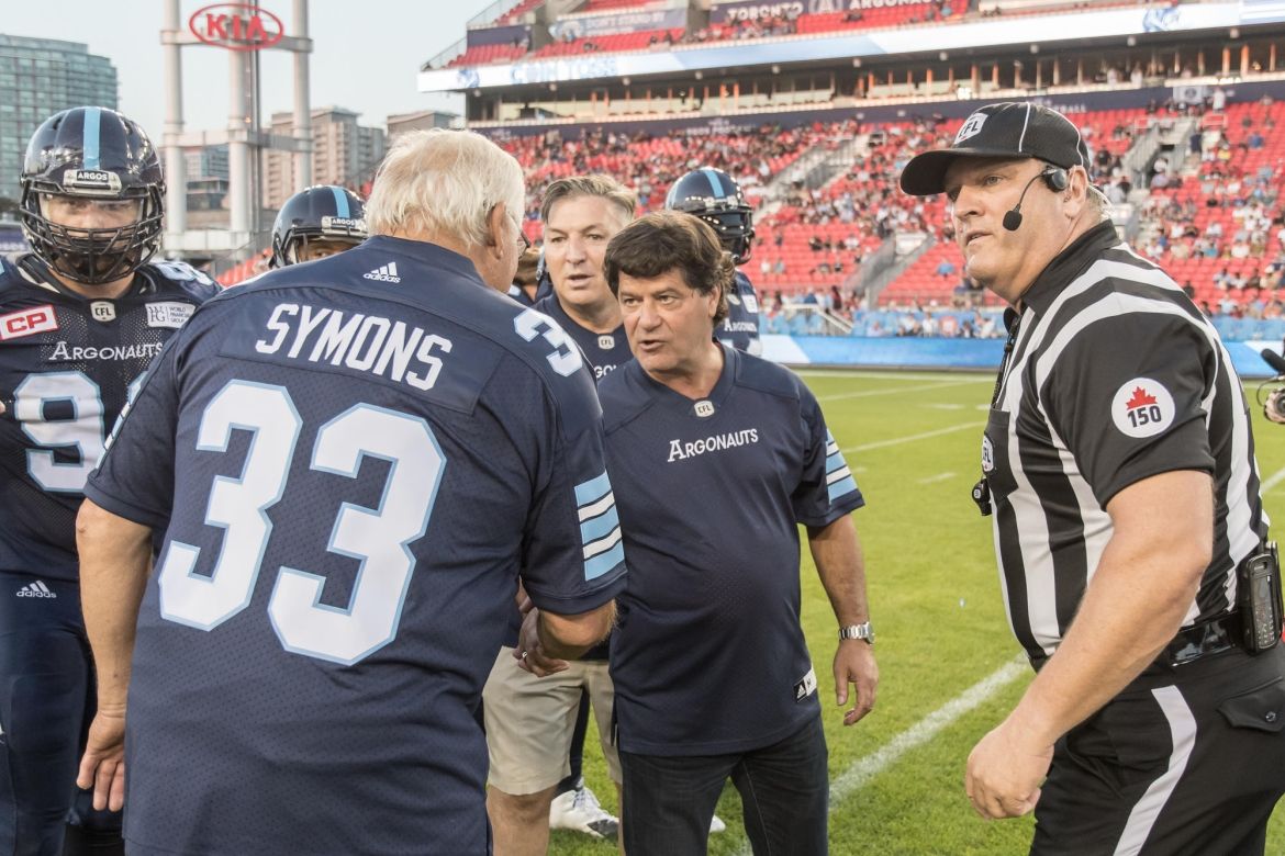 Jerry Dias during the coin toss at a Toronto Argonauts game.