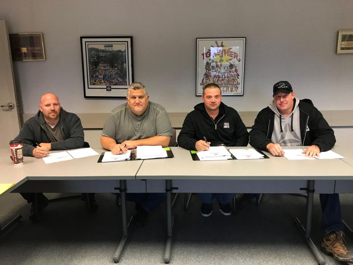 The bargaining committee for Local 444 members working at GFL.