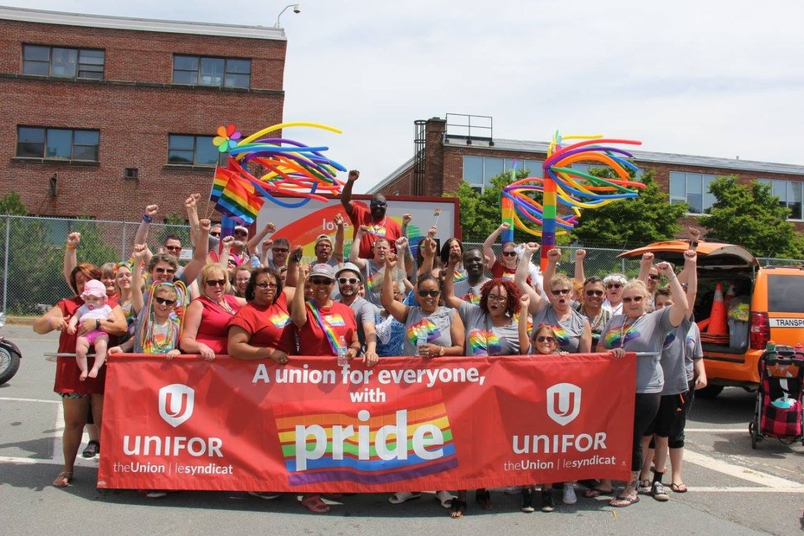 Unifor members participate in a Pride Parade.