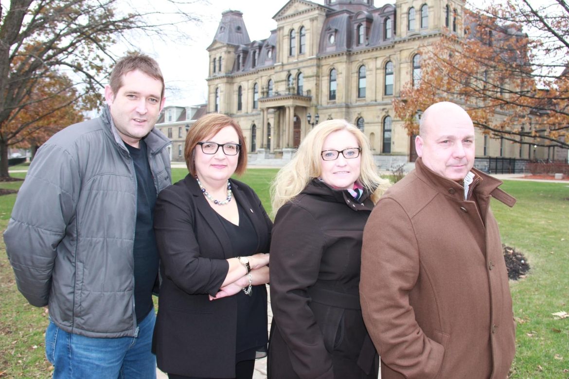 Lana Payne and Unifor activists in front of the New Brunswick legislature building.