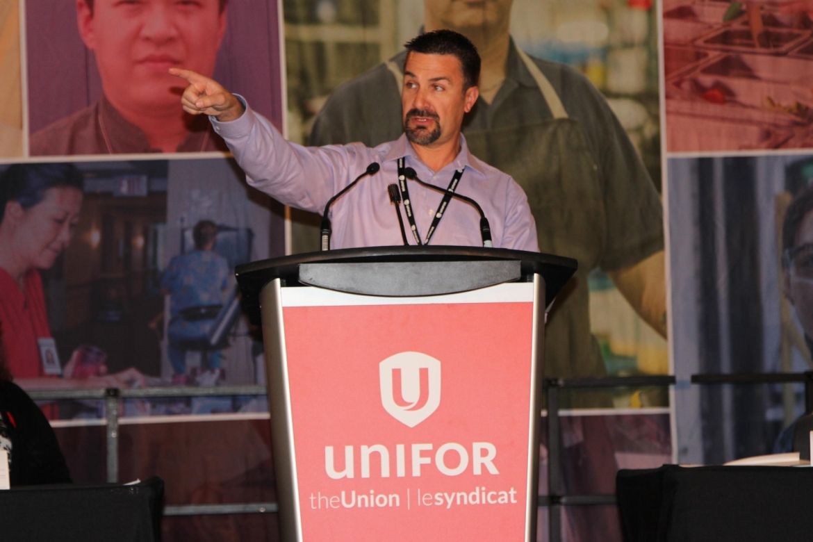 B.C. Regional Council Chair Ben Williams speaks at a podium.