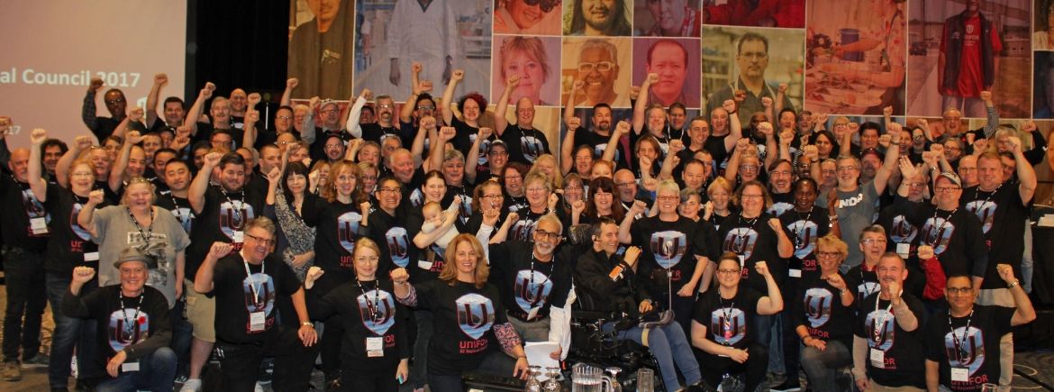 A large group of Unifor members in matching t-shirts at BC regional council.