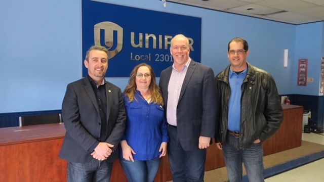 Gavin MacGarrigle and Premier John Horgan with members of Unifor Local 2301.