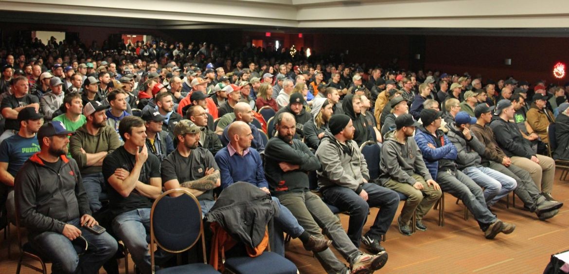 Hundreds of members of Unifor Local MWF-1 seated in a meeting hall.