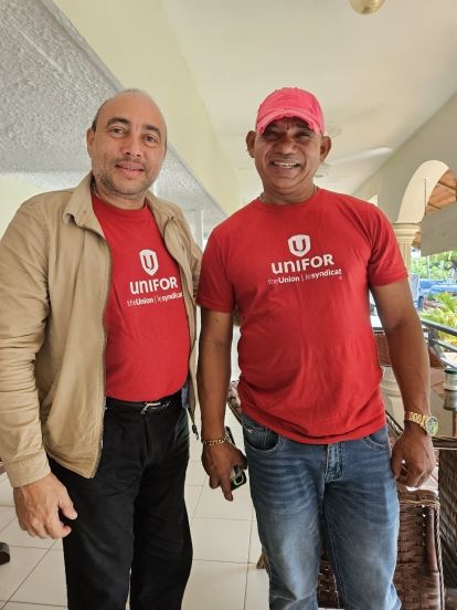 two people wearing red unifor shirts