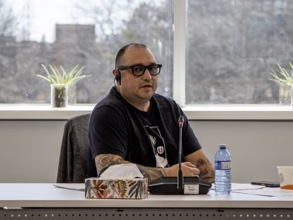 Ted Haggard seated and speaking into a microphone