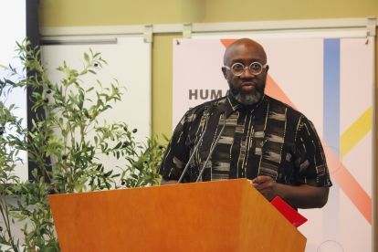 A man speaks at a podium