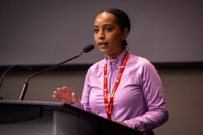 A women speaks at a podium