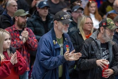 A group of people clapping
