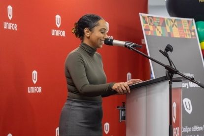 A women speaks at a podium.