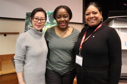 Three women posing smiling