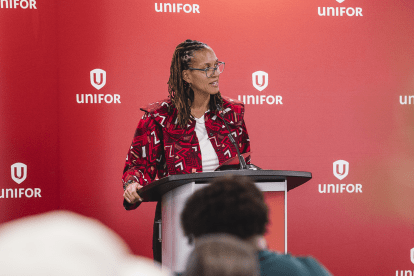 A women speaks at a podium