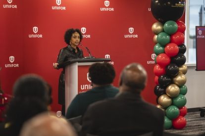 A women speaks at a podium