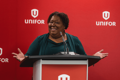 A women speaks at a podium