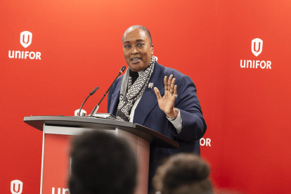 A women speaks at a podium