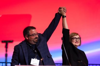 Daniel Cloutier and Lana Payne holidng hands fists raised