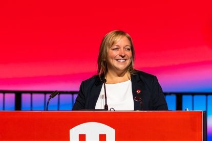 Jennifer Murry speaking at a podium