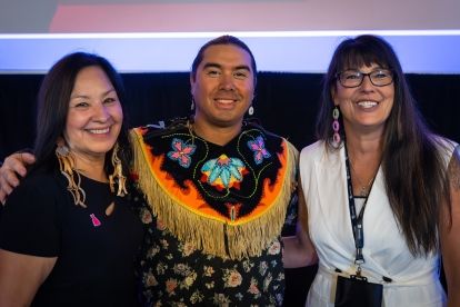 Three people smiling